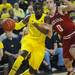 Michigan junior Tim Hardaway Jr. moves the ball around Indiana junior Will Sheehey during the first half at Crisler Center on Sunday, March 10, 2013. Melanie Maxwell I AnnArbor.com